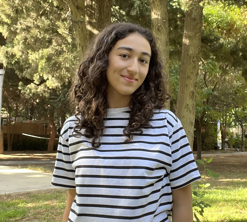 Student in stripey top