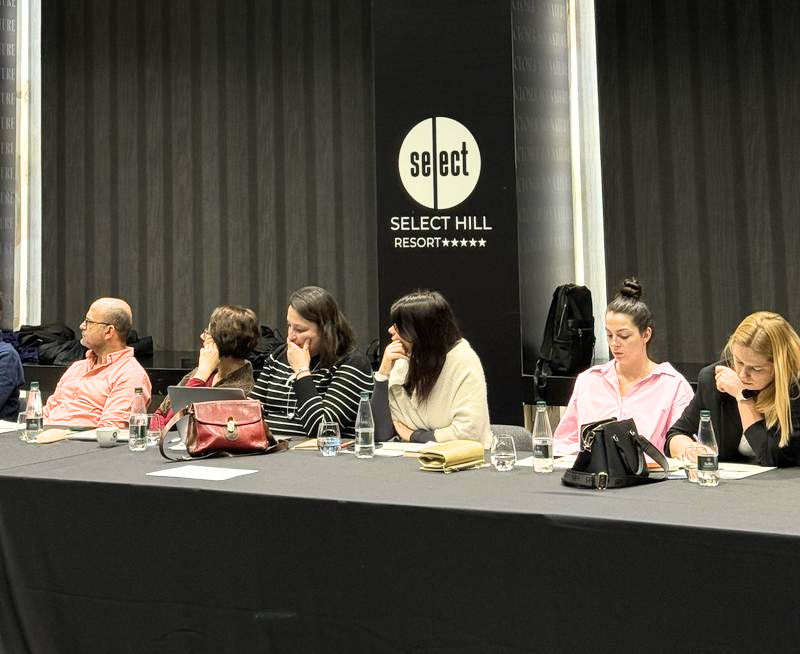 Workshop delegates engaged in listening to someone talking