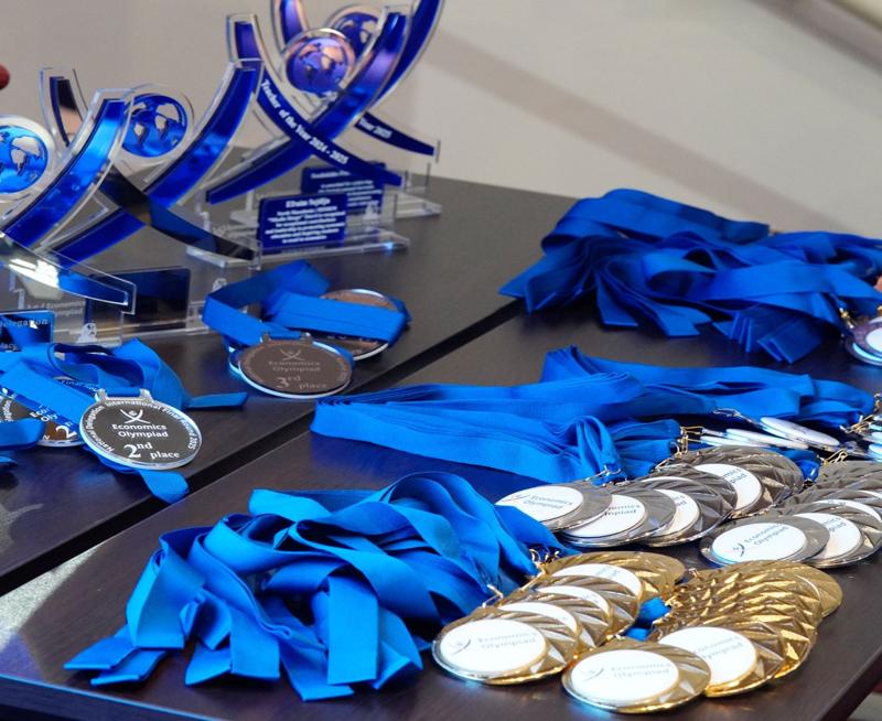 Close up of medals on a table at the Economics Olympiad