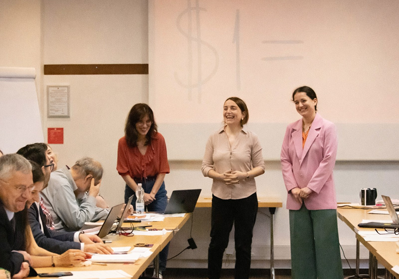 Teachers smiling as they present a workshop in a classroom